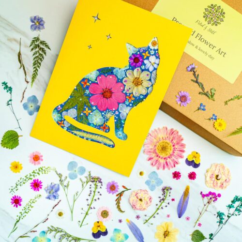 Handmade floral cat card with bright colorful flower patterns on yellow background, Petal & Still botanical art, greeting card for plant lovers, floral illustration, inspiration for botanical design, nature-inspired art.