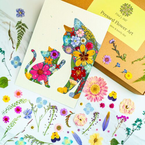 Flower collage art of a cat and dog with vibrant floral patterns, botanical pressed flower art, handmade floral illustration, petal & still botanical artwork for home decor and gifts.