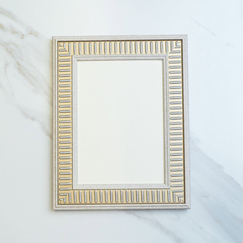 Elegant decorative mirror frame with gold accents and geometric design, perfect for modern home or office decor. Enhance your space with stylish, high-quality wall art.