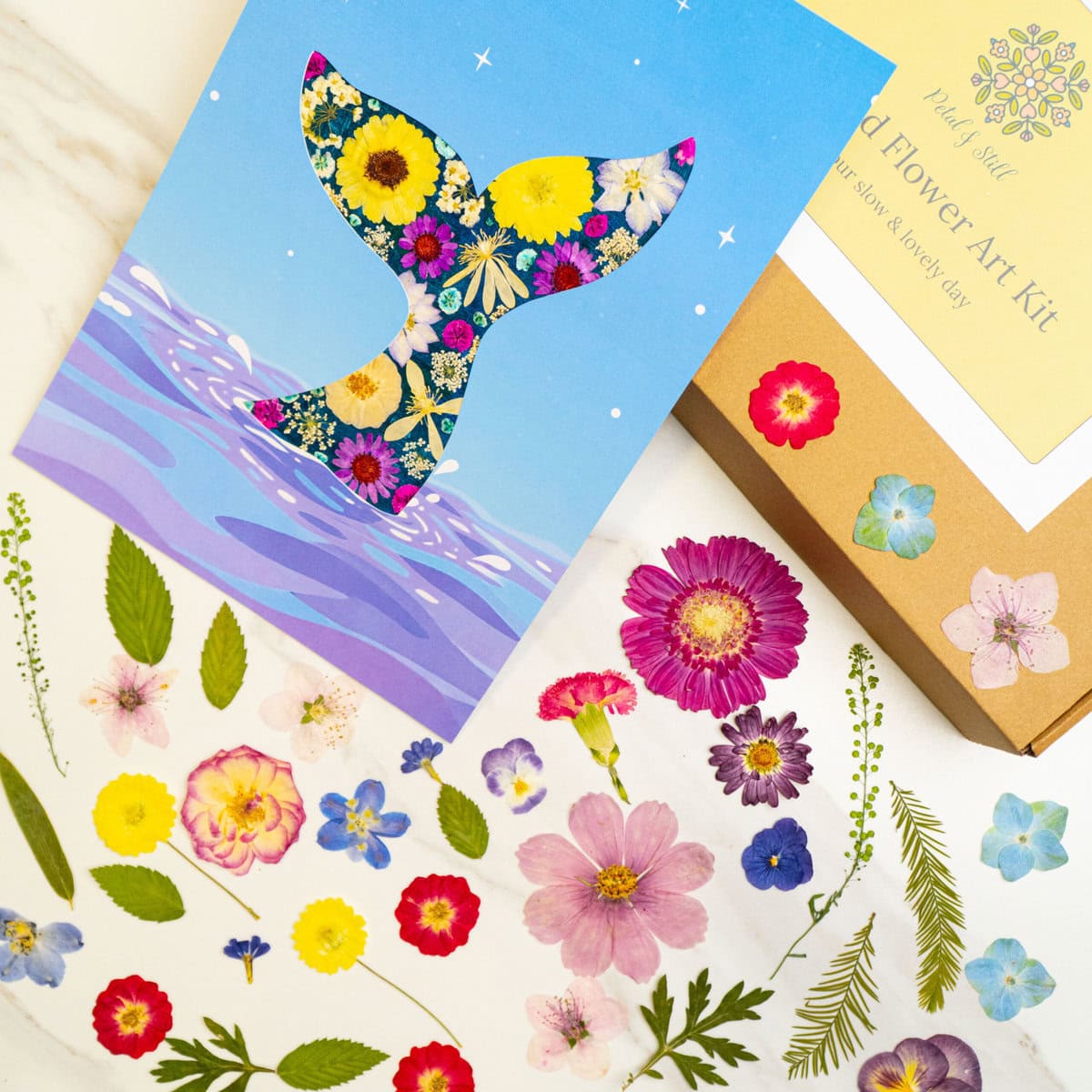 Whale-shaped floral art print on a blue background with water details, creator Petal & Still, perfect for floral and watercolor art decor.